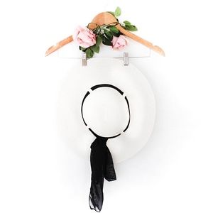 White wide brimmed hat with black chiffon ribbon
